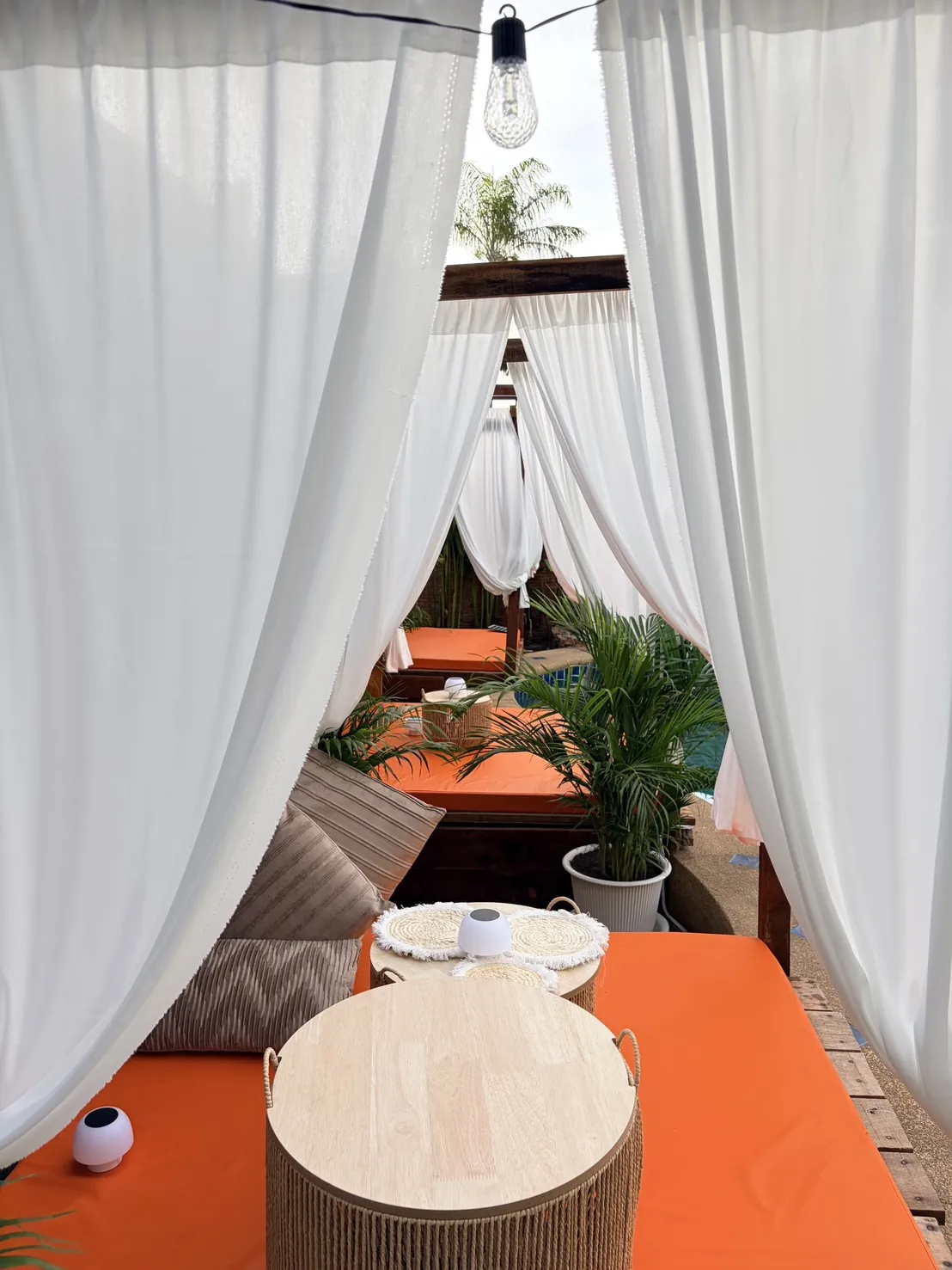 Curtained daybed by the pool at Dewata Pattaya